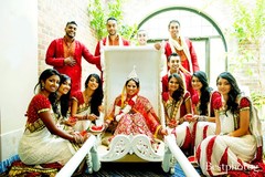 For their gorgeous Indian wedding ceremony, this couple opts for a traditional gold and ruby red color palette.