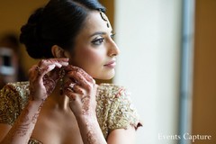 This Indian bride prepares for her traditional ceremony with beautiful hair and makeup before meeting her Raja for portraits.