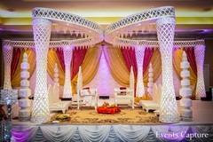 At this Indian wedding ceremony, the bride and groom opt for a beautiful red and gold color palette.