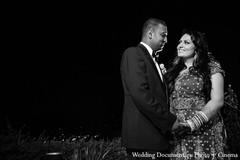 An Indian bride and groom pose for portraits during their wedding festivities.