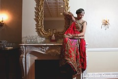 This beautiful Indian bride prepares for her sensational wedding with professional hair and makeup and a stunning multi-hued lengha.