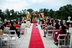 For their traditional Indian wedding ceremony, this bride and groom opt for a beautiful red and gold theme.