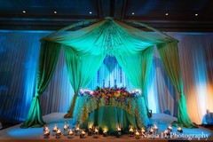 This Indian wedding reception is decked out in whimsical florals and a luminous blue glow.