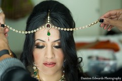 An Indian bride and groom get ready for their beach wedding.