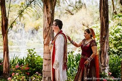 An Indian bride and groom take some portraits during their wedding festivities.