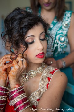 For her sensational destination wedding, this Indian bride opts for professional hair and makeup and a stunning ruby and cream lengha!