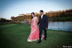 An Indian bride and groom take wedding portraits.