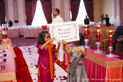 This traditional Indian wedding ceremony is brimming with pink and gold decor that totally shines!