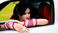 An Indian bride and groom pose for wedding portraits.