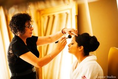 This Indian bride is preparing for her traditional ceremony with professional hair and makeup!