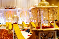 For their traditional Indian wedding ceremony, this bride and groom opt for an opulent stage and champagne-colored details!