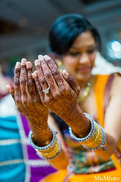 An Indian bride and groom take some portraits at their sangeet.