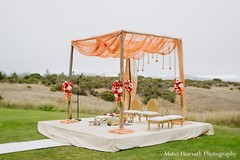 This Indian bride and groom tie the knot in an outdoor ceremony under a beautiful floral mandap!