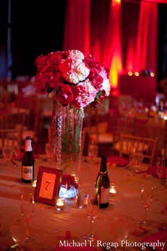 An Indian bride and groom celebrate at their wedding reception.