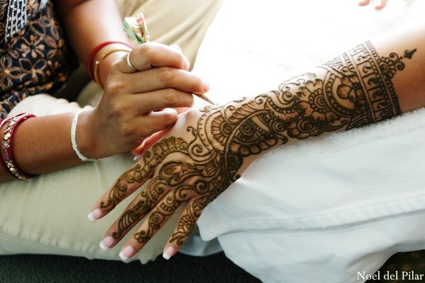 A bride gets mehndi applied for her wedding.