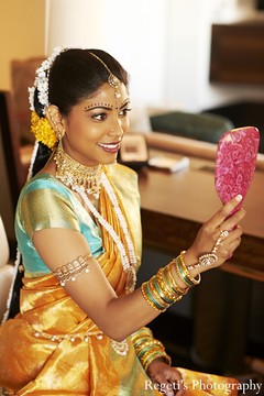 This Indian bride prepares for her big day with beautiful hair and makeup and a gorgeous sari!