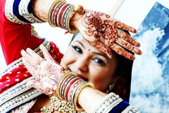 This Indian bride prepares for her wedding day with beautiful hair and makeup and a sensational ruby red lengha!