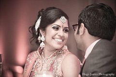 This Indian bride is all smiles at her wedding reception!