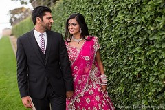 This Indian bride and groom celebrate their marriage at their wedding reception.