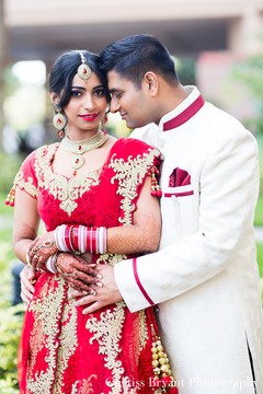 This Indian bride and groom pose for beautiful wedding portraits.