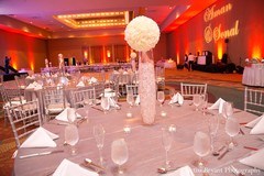 This Indian wedding reception is a glowing affair with silver decor.