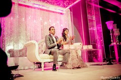 This lovely Indian bride and groom celebrate at their wedding reception.