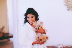 This Indian bride prepares for her wedding with lovely hair and makeup.