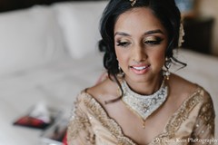 This Indian bride prepares for her big day with professional styling.