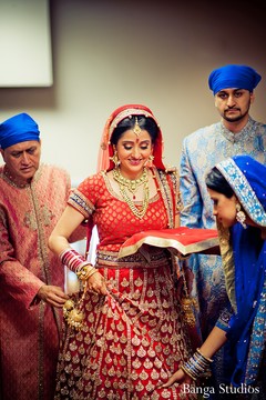 This Sikh bride prepares for her traditional wedding ceremony.