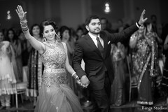 This Indian bride and groom celebrate at their wedding reception.