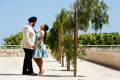 A bride and groom have an engagement portrait session