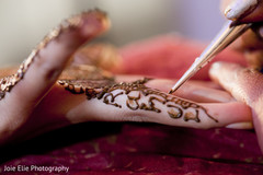 A bride gets her mehndi applied for her wedding.