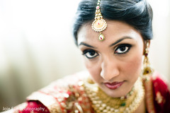 An Indian bride poses for wedding portraits.