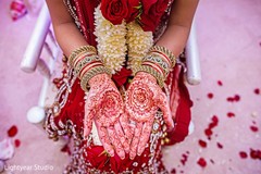 A bride shows off her wedding mehdni.