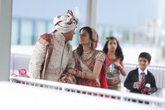 A bride and groom pose for wedding portraits.