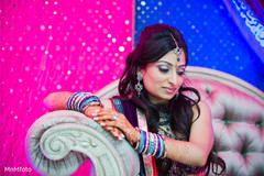 An Indian bride and groom celebrate before their wedding at their sangeet.