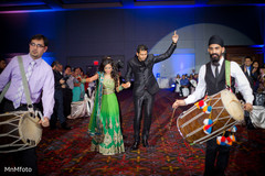 An Indian bride and groom celebrate at their wedding reception!