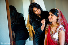 This Indian bride prepares for her wedding with beautiful hair and makeup.