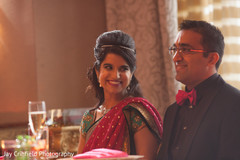 A bride and groom celebrate at their wedding reception.