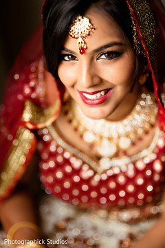 This Indian bride gets beautiful hair and makeup for her wedding day.