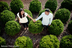 An Indian bride and groom pose for engagement portraits.