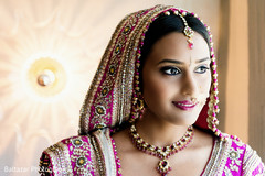 An Indian bride and groom get ready for their wedding.