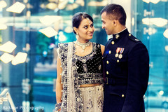 An Indian bride and groom celebrate at their wedding reception.