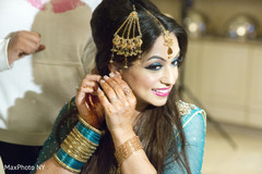 This Pakistani bride gets all dolled up with lovely hair and makeup.