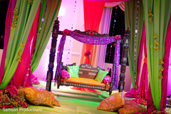 A bride and groom celebrate at their lively mehndi night.