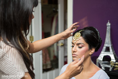 An Indian bride and groom get ready for their wedding celebrations.