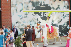 An Indian groom leads his baraat to the ceremony venue.