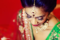 A bride shows off her hair and makeup.