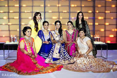 An Indian bride and groom are brilliant in royal blue for their wedding reception.