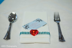 This Indian wedding reception includes lovely heart-shaped favors for guests.